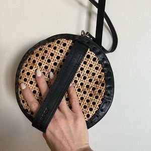 Adorn crossbody bag with caning detail.